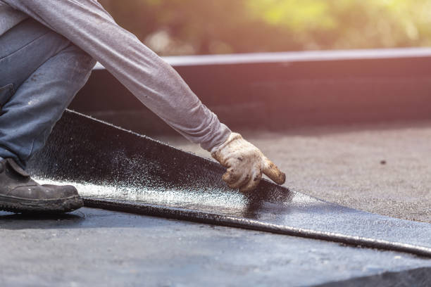 Professional Basement Waterproofing technician working in Winfield, TN